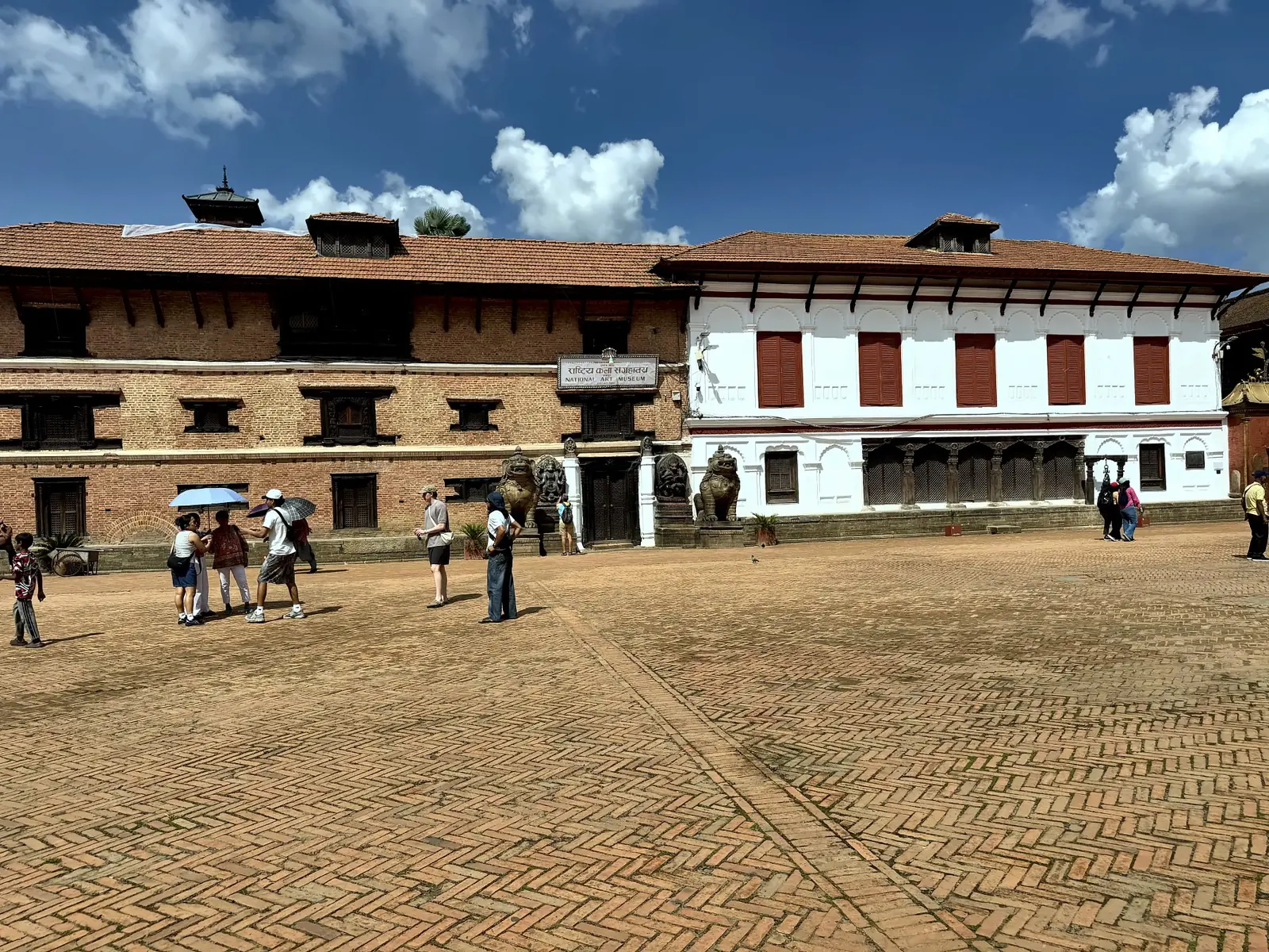 Brick and whitewashed royal palace buildings on Bhaktapur Durbar Square